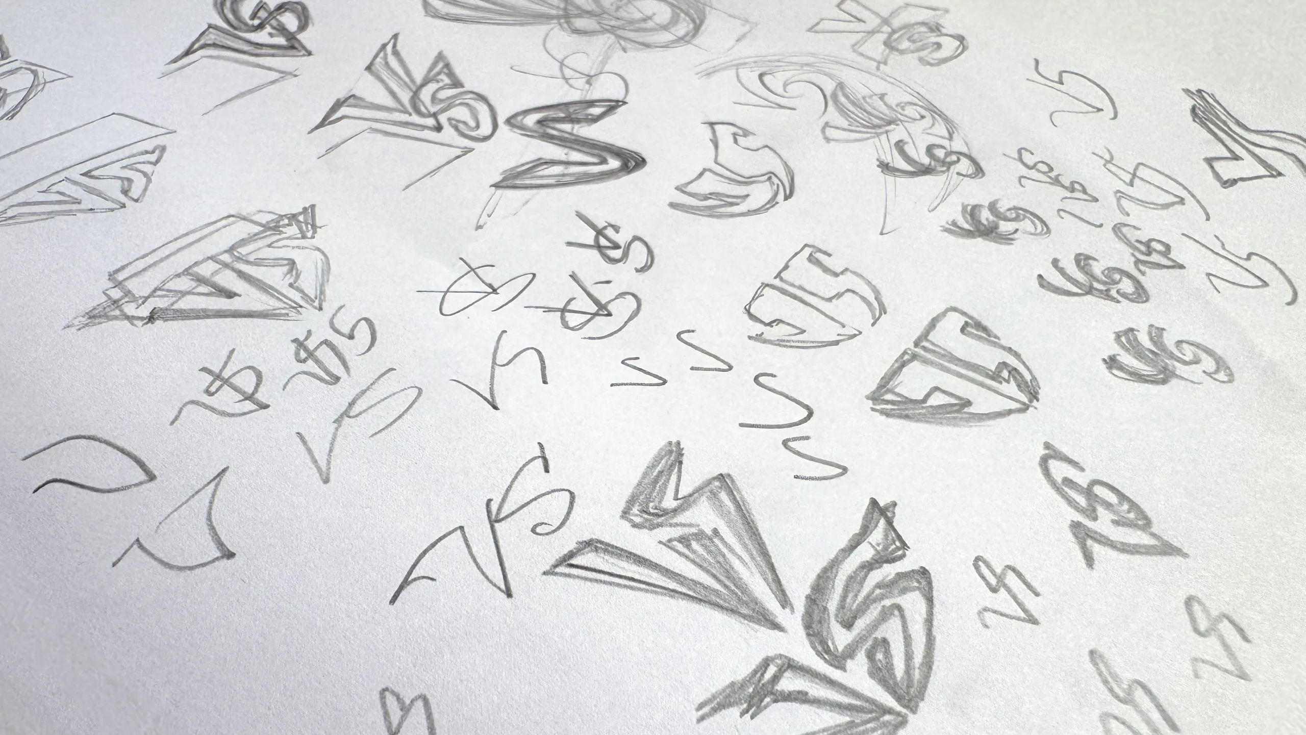 Pencil sketches of logo explorations